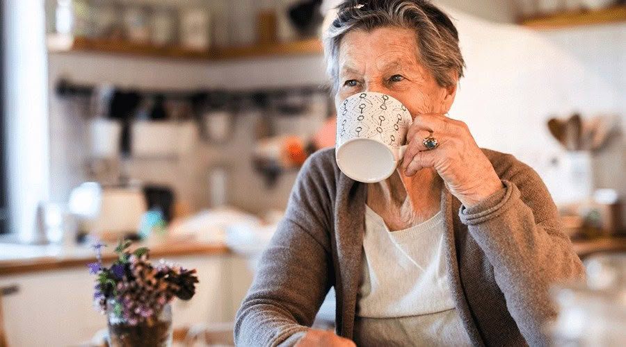 old woman drinking tea